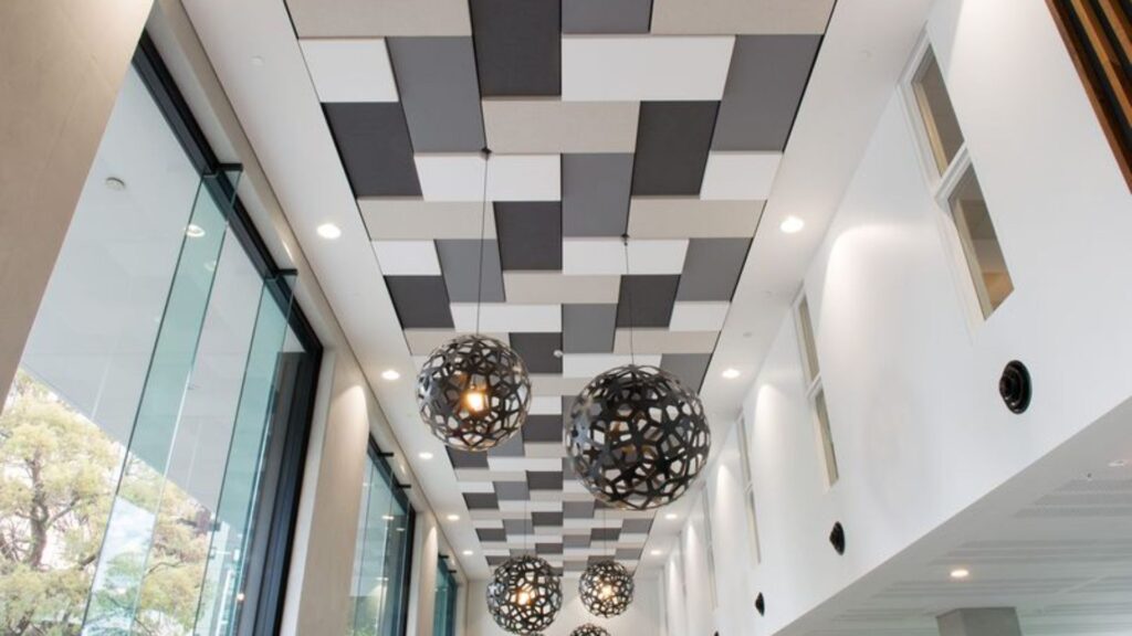 How do acoustic ceiling tiles work?